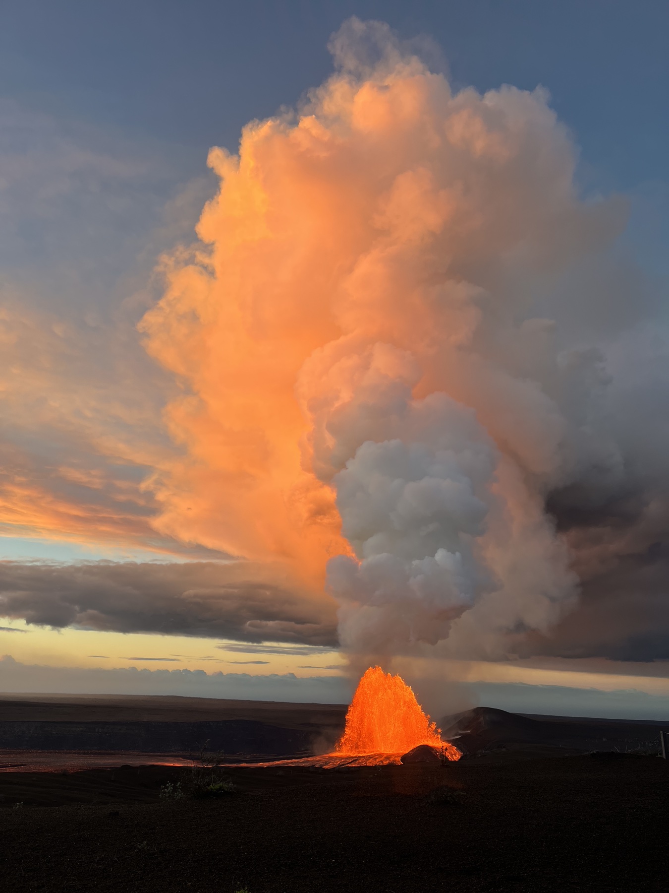 Kīlauea eruption plume illuminated at sunrise